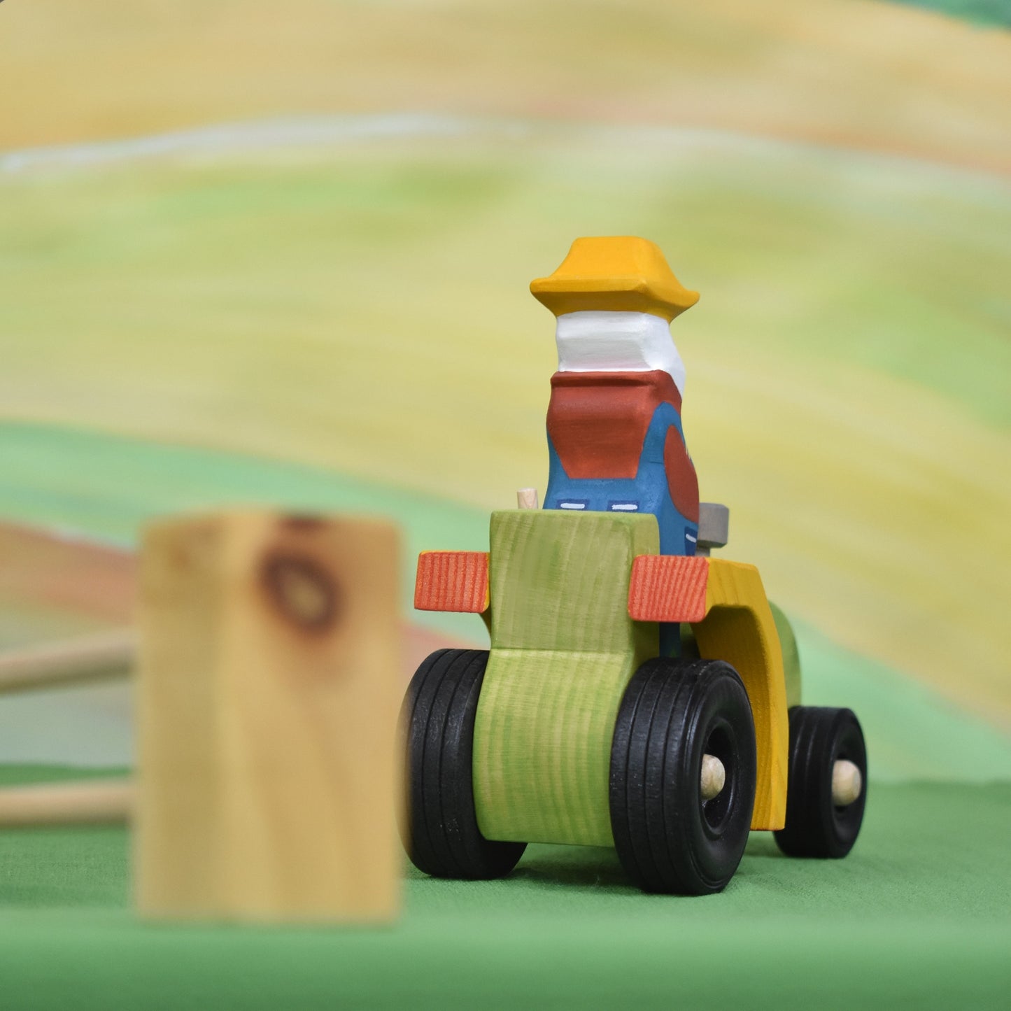 Wooden tractor toy and farmer