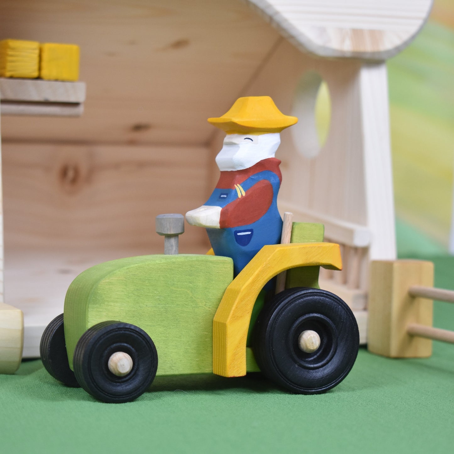 Wooden tractor toy and farmer